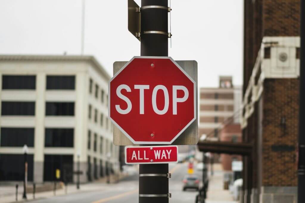Red stop sign on city street