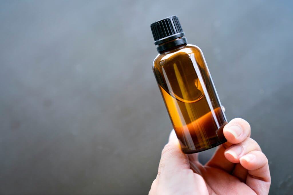 clear bottle being held